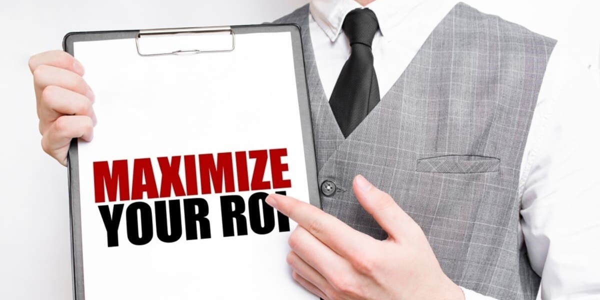 holding a tablet that says maximize ROI