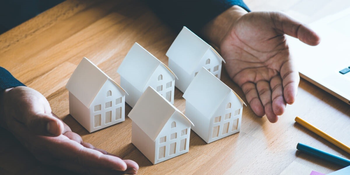 man with five model houses - featured_image